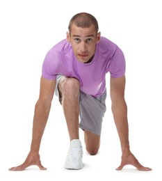 Photo of Runner in starting position on white background