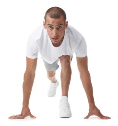 Photo of Runner in starting position on white background