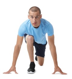 Photo of Runner in starting position on white background