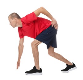 Photo of Runner in starting position on white background