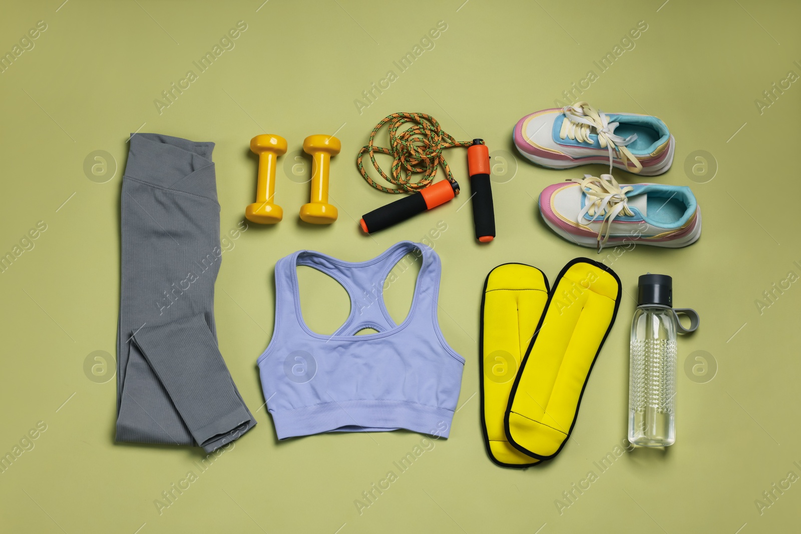 Sportswear, sneakers, dumbbells, skipping rope, water bottle and ankle weights on pale olive background, flat lay Photo of Sportswear, sneakers, dumbbells, skipping rope, water bottle and ankle weights on pale olive background, flat lay