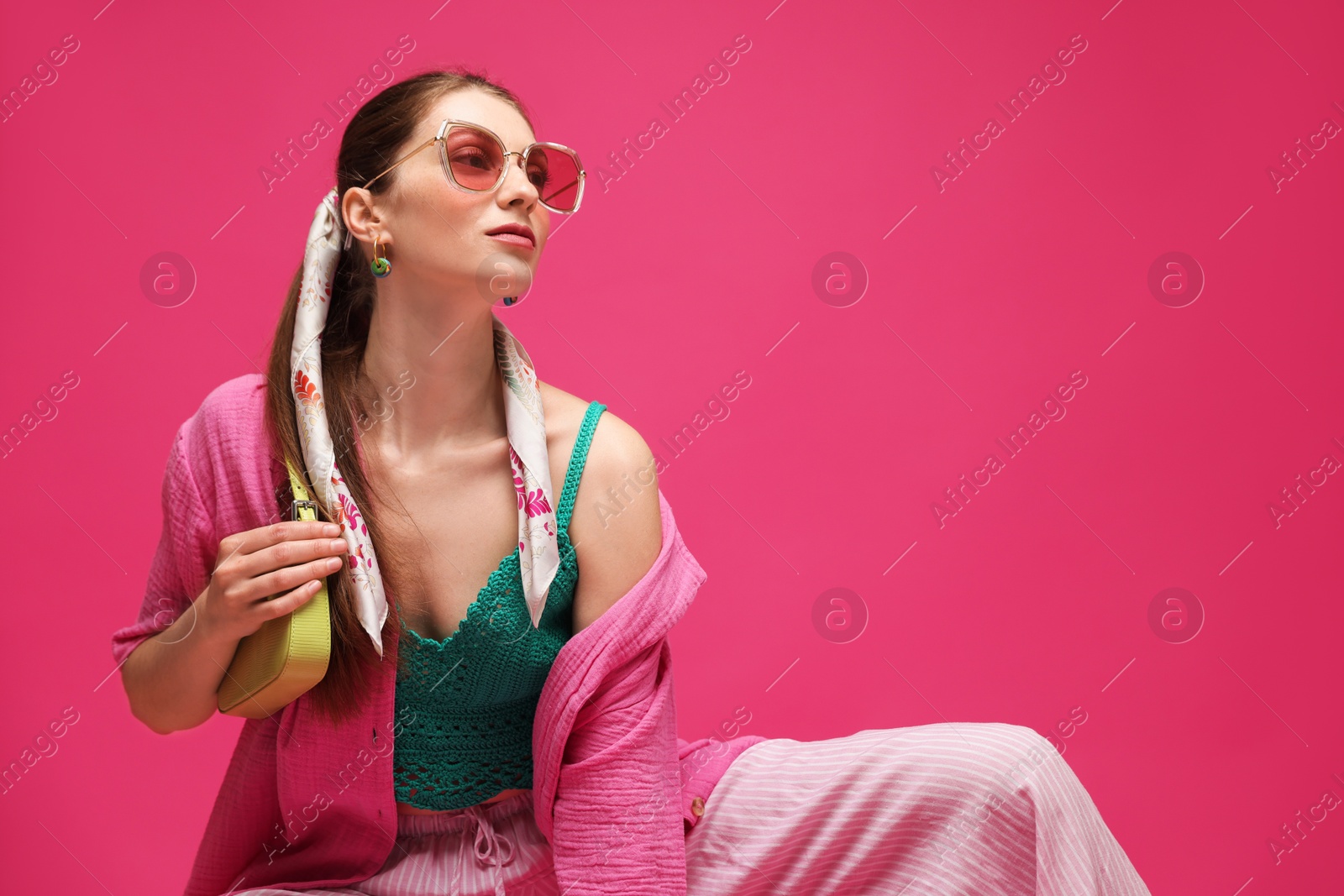 Fashionable portrait of beautiful woman in stylish outfit on pink background. Space for text Photo of Fashionable portrait of beautiful woman in stylish outfit on pink background. Space for text
