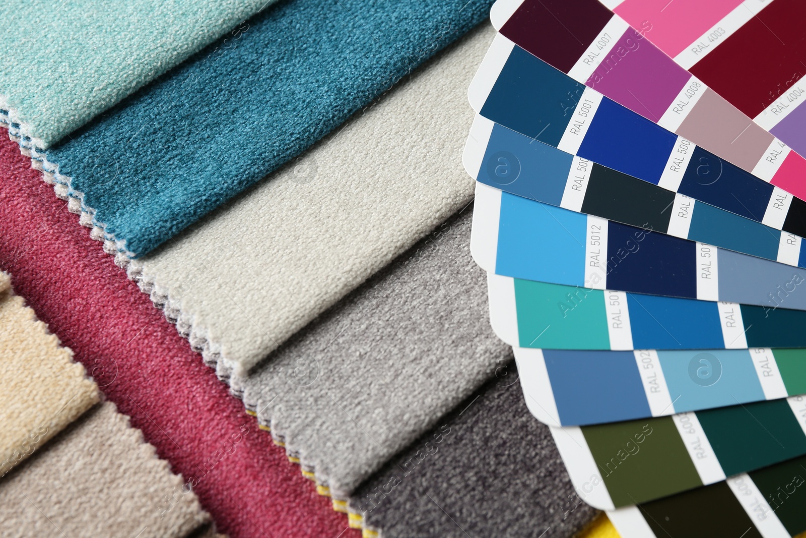 Samples of colorful fabrics and color palettes, above view Photo of Samples of colorful fabrics and color palettes, above view