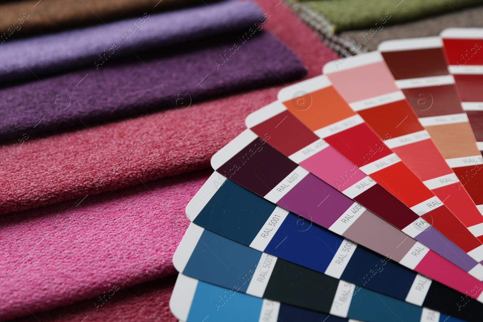 Samples of colorful fabrics and color palettes, closeup Photo of Samples of colorful fabrics and color palettes, closeup