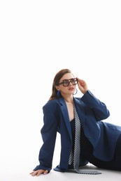 Photo of Young woman in stylish clothes on white background