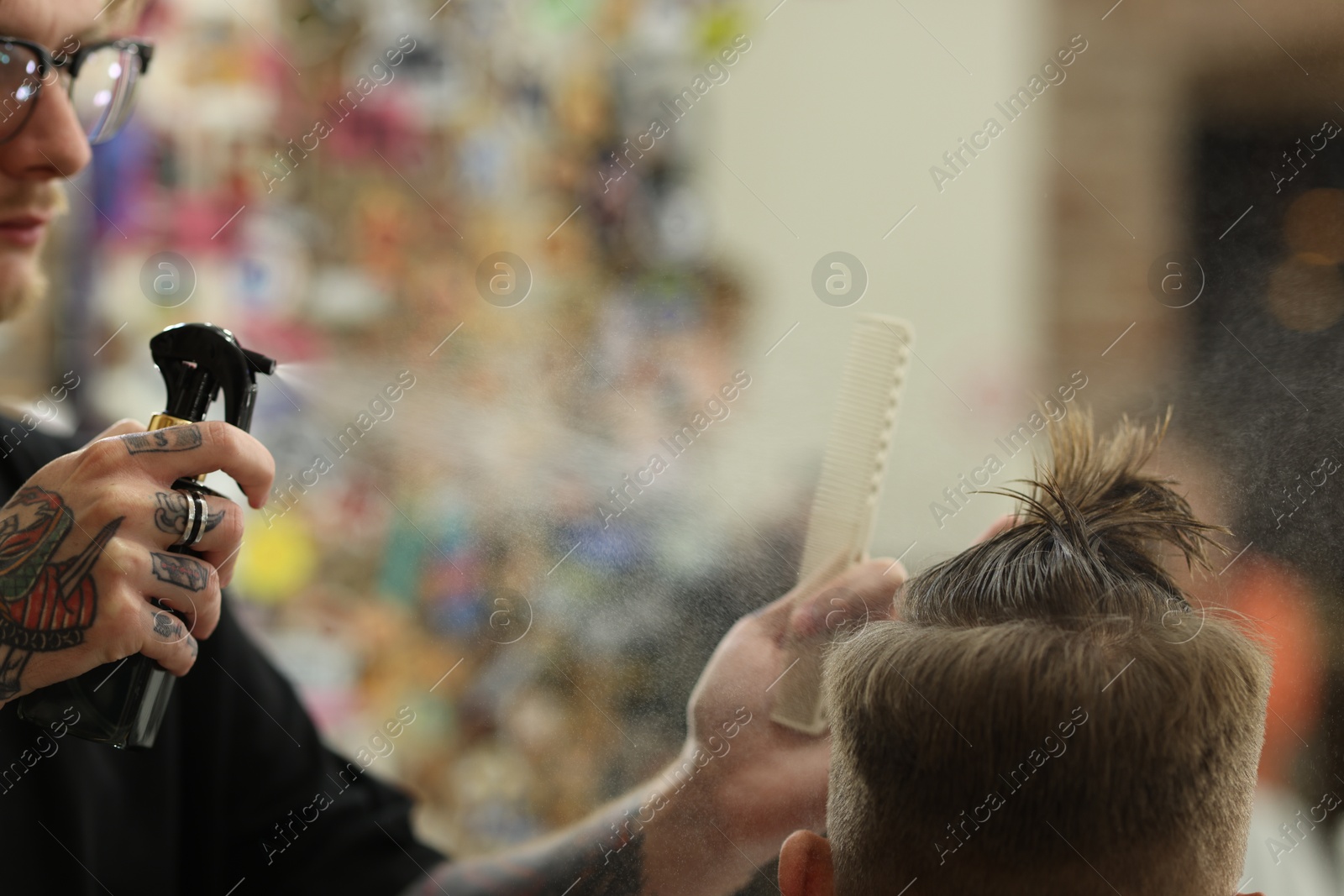 Professional barber making stylish haircut in barbershop, closeup Photo of Professional barber making stylish haircut in barbershop, closeup