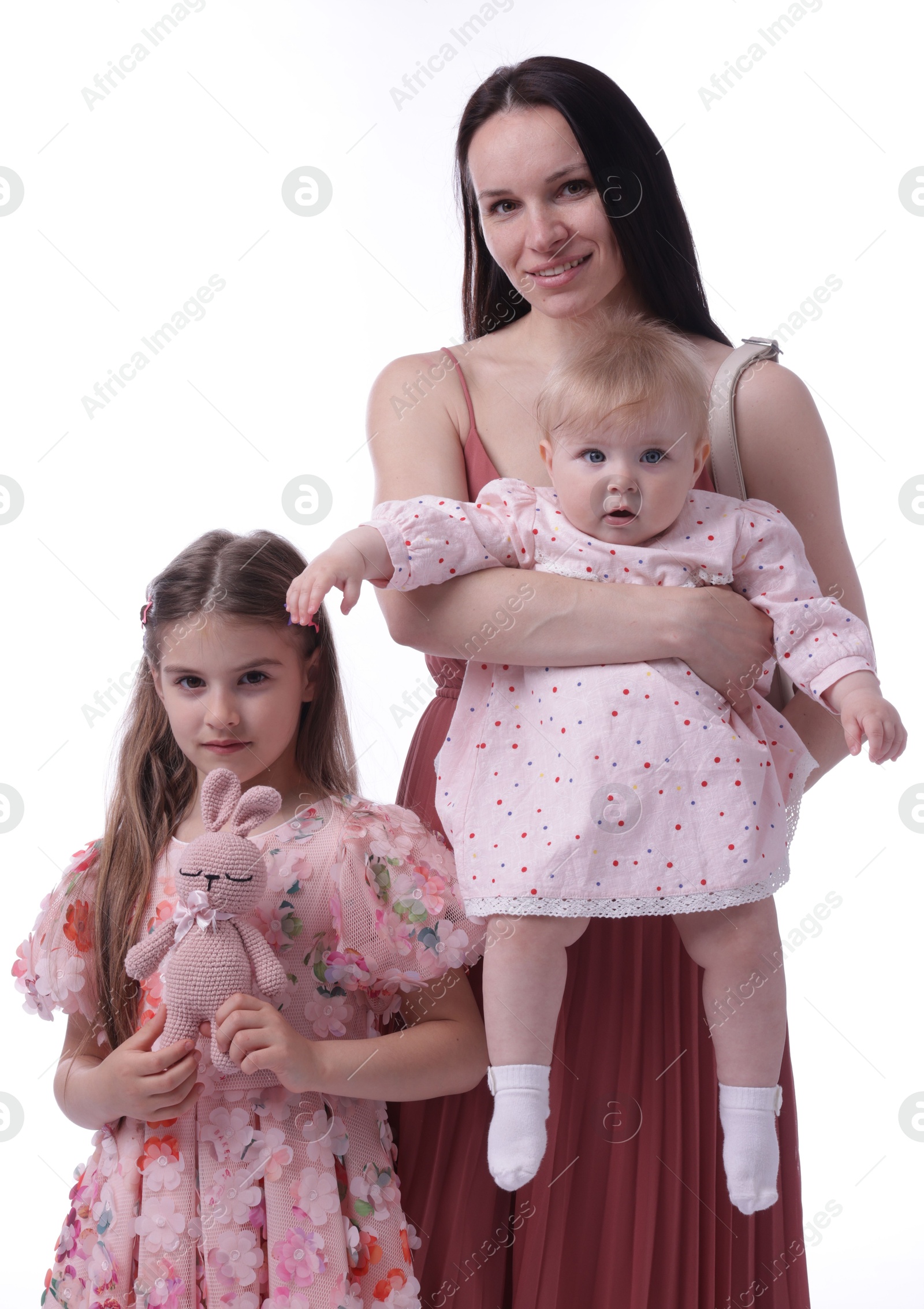 Mother and her cute kids on white background Photo of Mother and her cute kids on white background