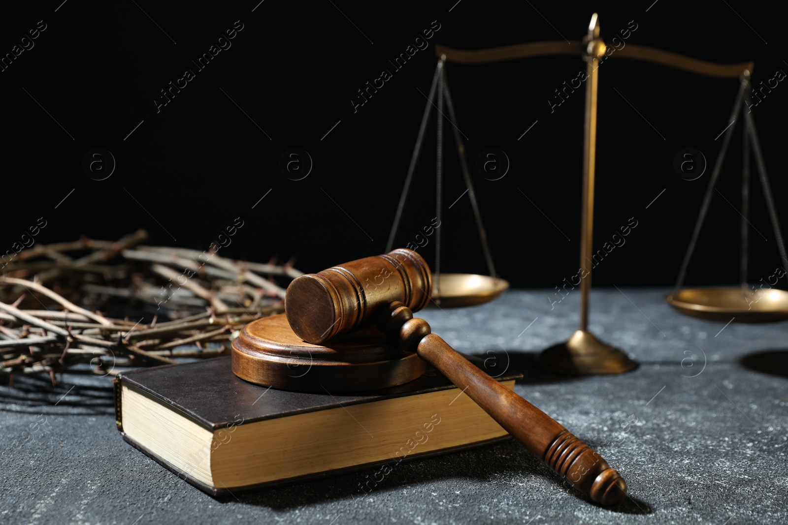 Crown of thorns, judge's gavel, Bible and scales on dark textured background Photo of Crown of thorns, judge's gavel, Bible and scales on dark textured background