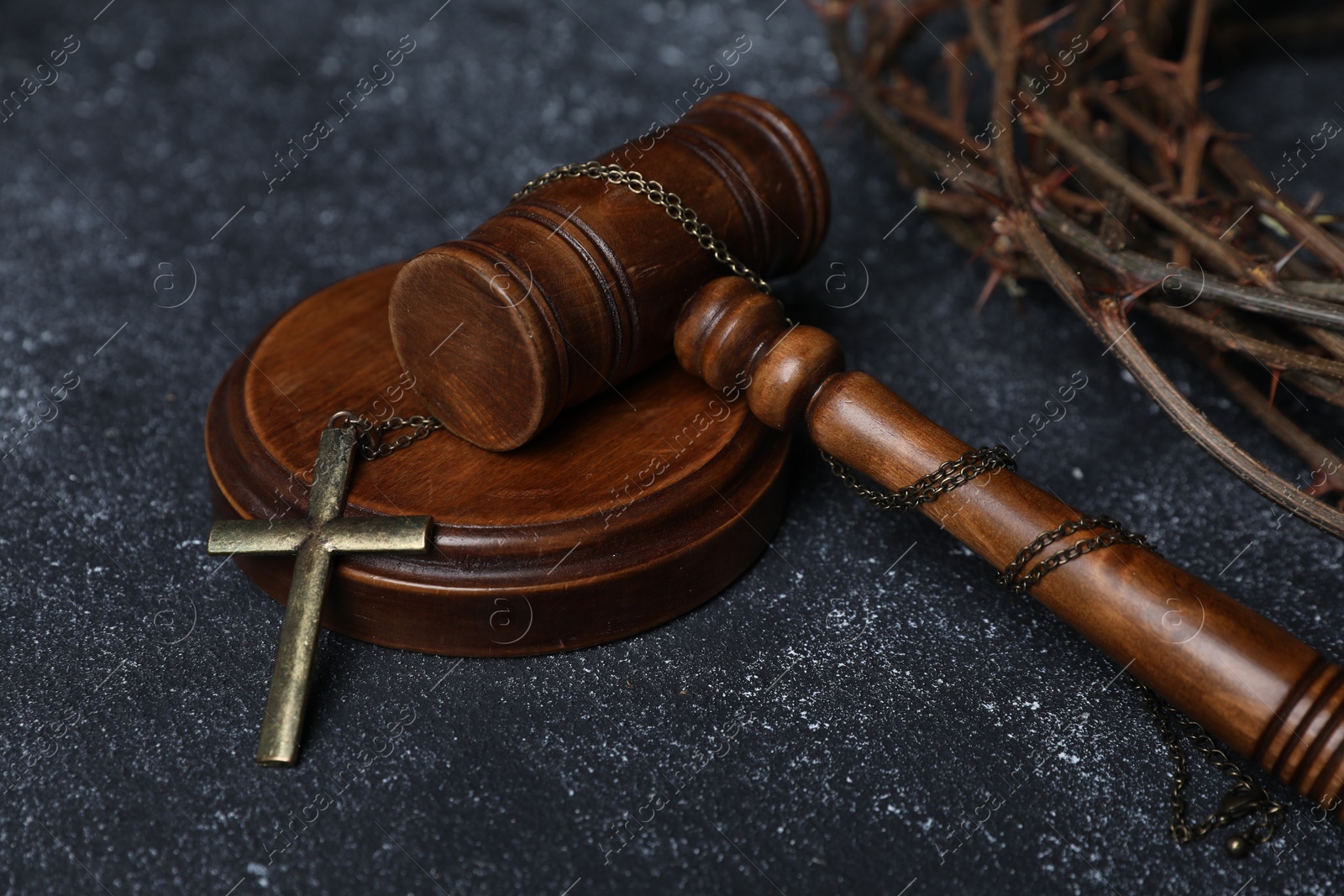 Crown of thorns and judge's gavel with cross on dark textured background, closeup Photo of Crown of thorns and judge's gavel with cross on dark textured background, closeup