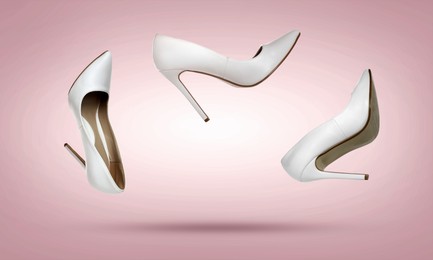 Image of Stylish high heel shoes in air on dusty pink gradient background
