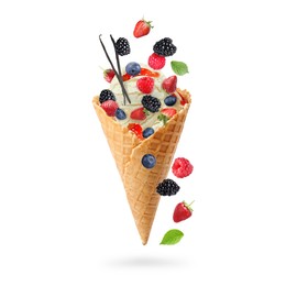 Image of Yummy ice cream ball in wafer cone and berries in air on white background