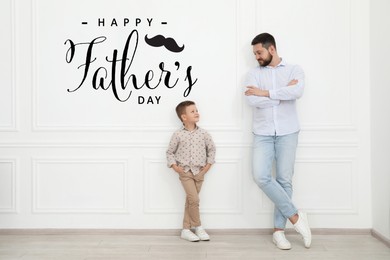 Image of Happy Father's Day. Daddy and his cute little son near white wall indoors