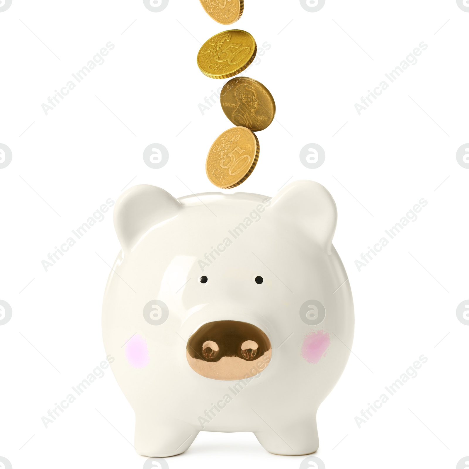 Coins falling into piggy bank on white background Image of Coins falling into piggy bank on white background