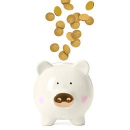 Image of Coins falling into piggy bank on white background