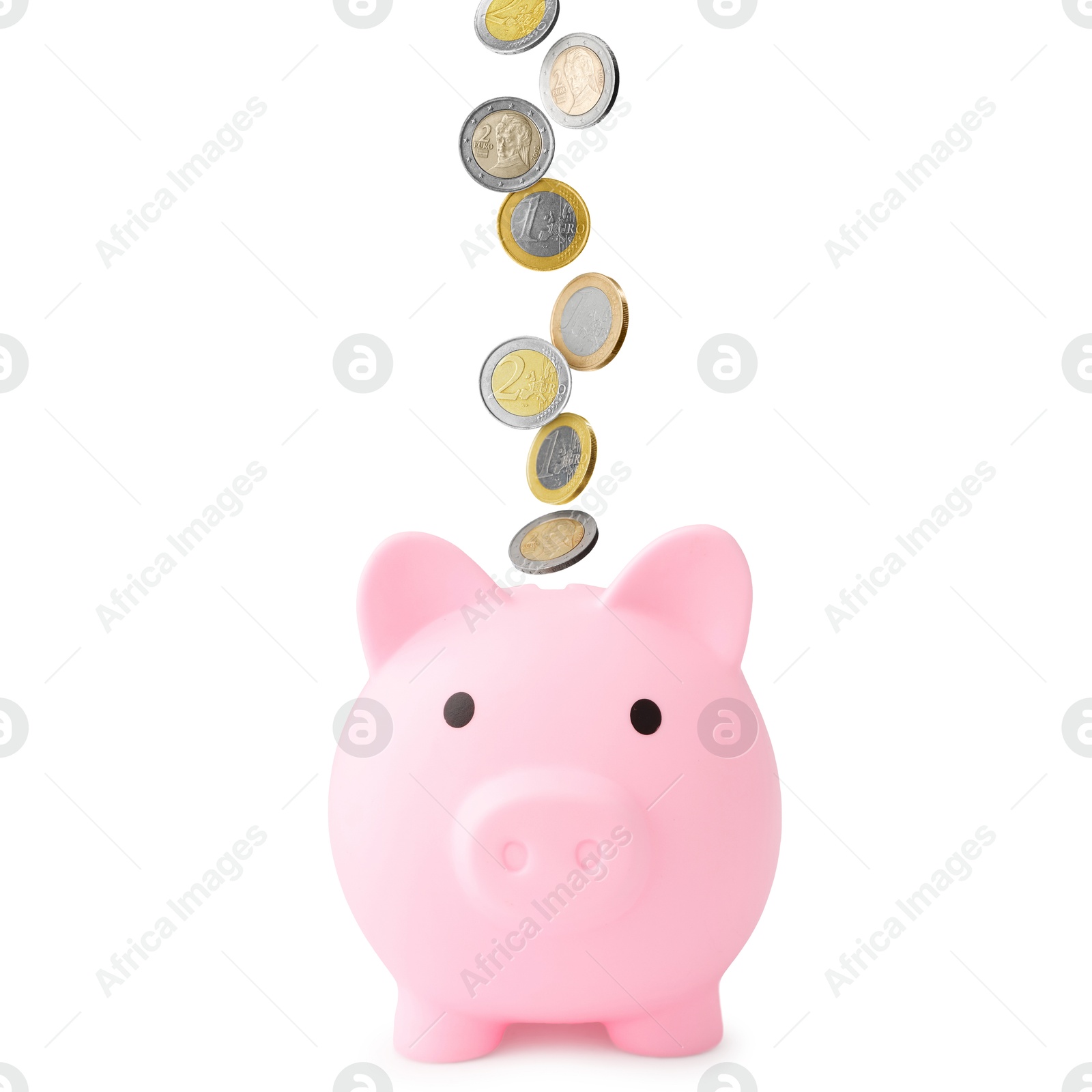 Coins falling into pink piggy bank on white background Image of Coins falling into pink piggy bank on white background