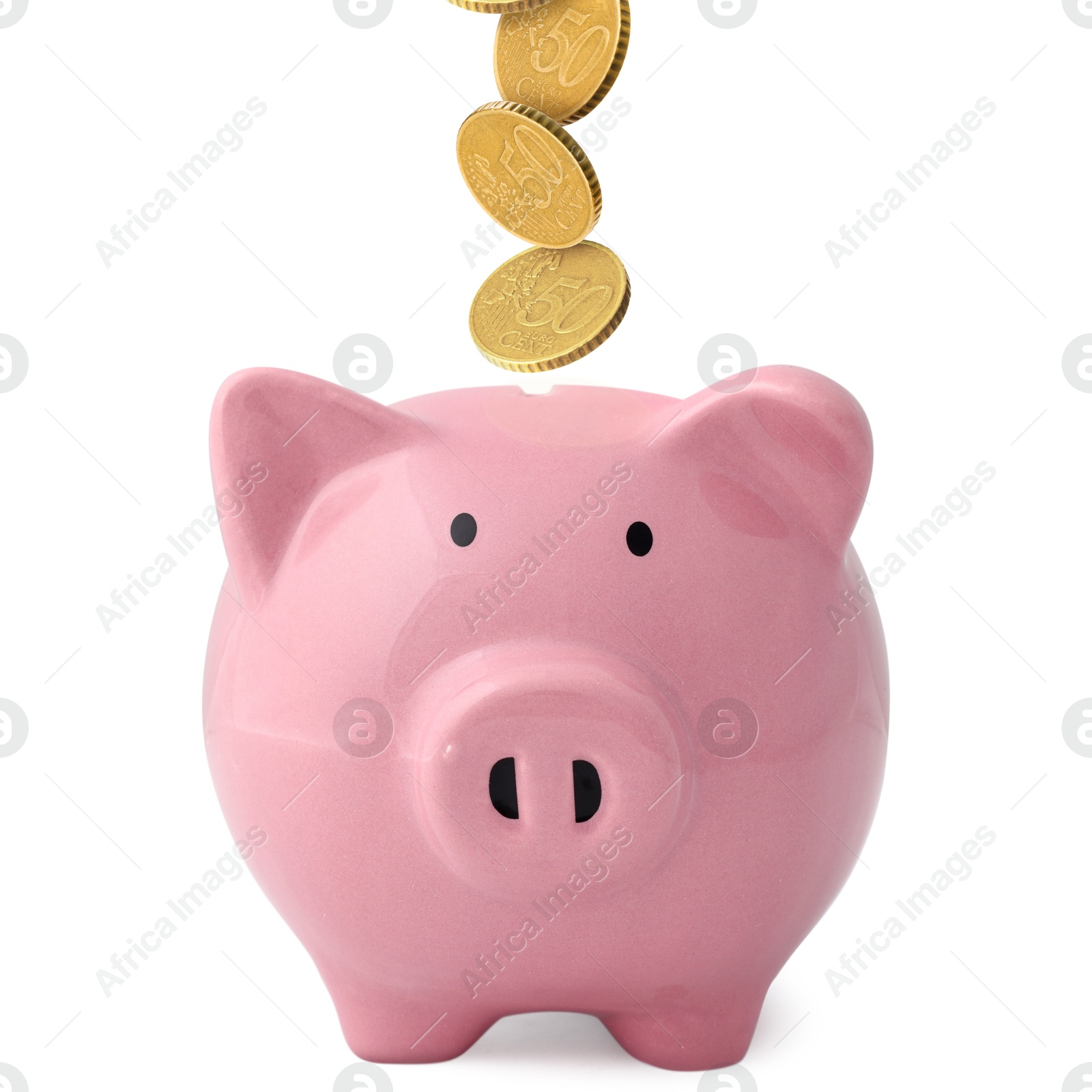 Coins falling into pink piggy bank on white background Image of Coins falling into pink piggy bank on white background