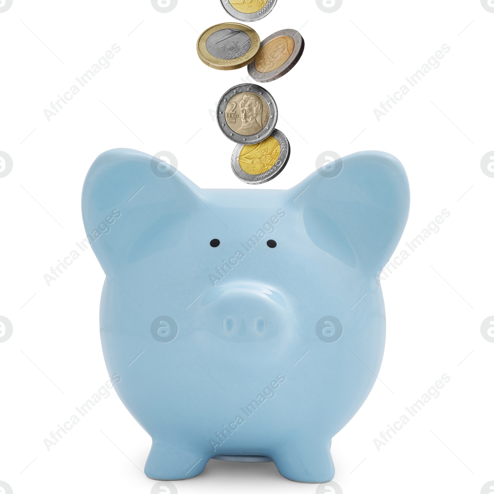 Coins falling into light blue piggy bank on white background Image of Coins falling into light blue piggy bank on white background