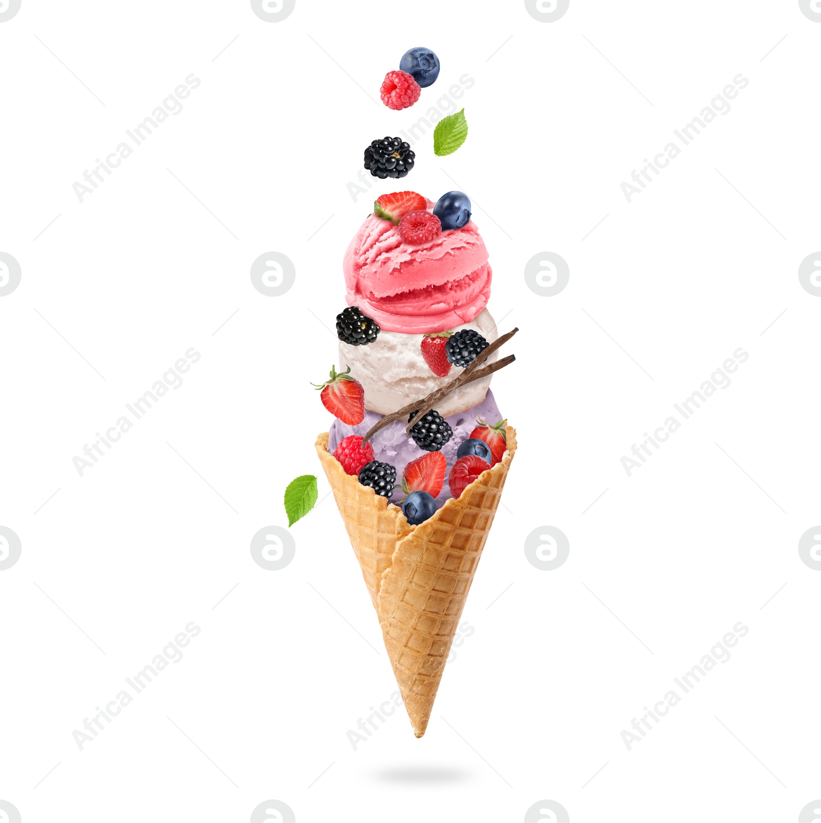 Image of Yummy ice cream balls in wafer cone and berries in air on white background