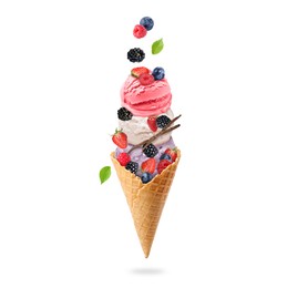 Image of Yummy ice cream balls in wafer cone and berries in air on white background