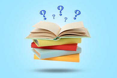 Image of Question marks and books in air against light blue background