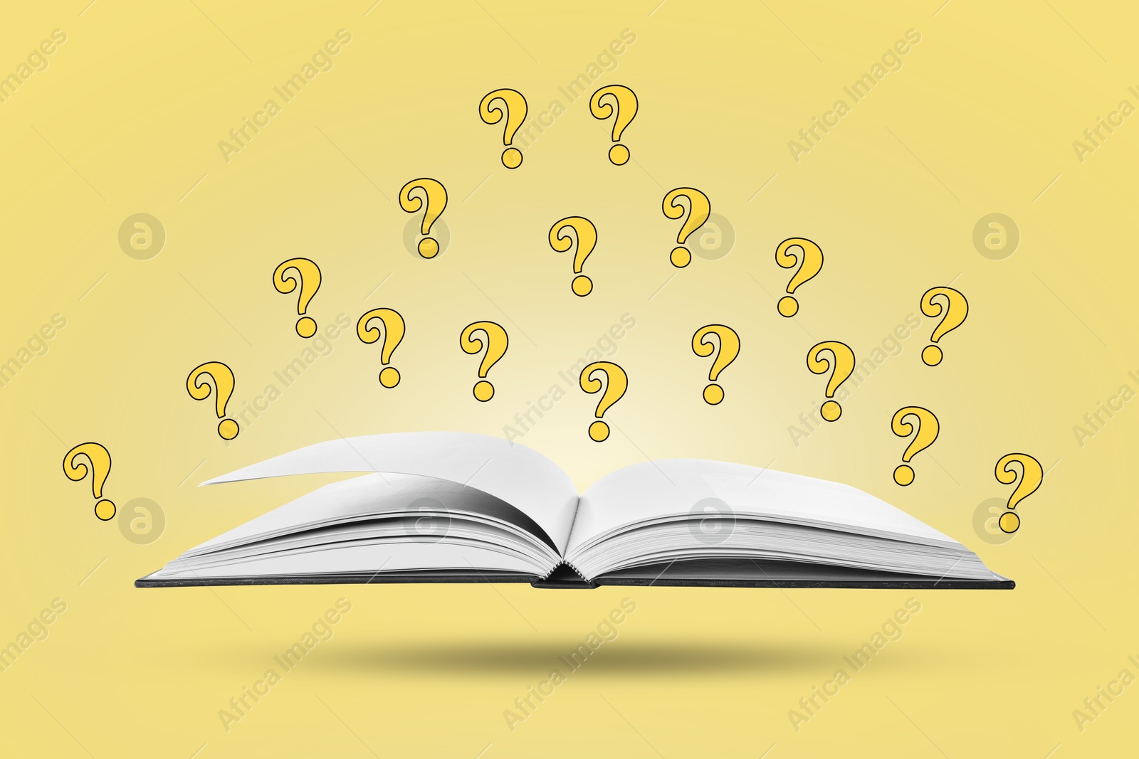 Question marks above open book in air against pale yellow background Image of Question marks above open book in air against pale yellow background
