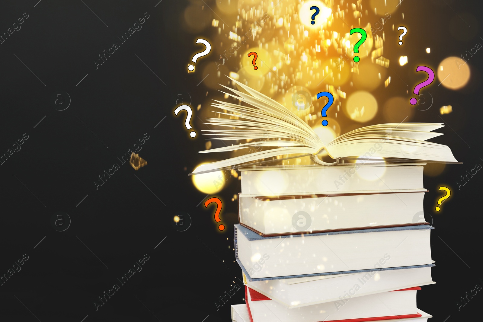 Question marks above open book against black background with blurred lights Image of Question marks above open book against black background with blurred lights