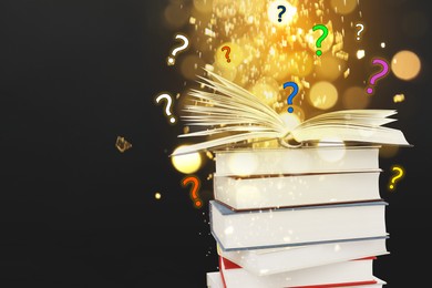 Image of Question marks above open book against black background with blurred lights