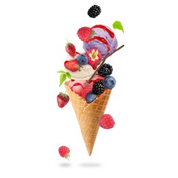 Image of Yummy ice cream balls, wafer cone and berries in air on white background