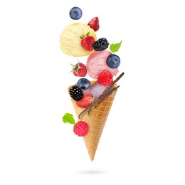 Image of Yummy ice cream scoops, wafer cone and berries in air on white background