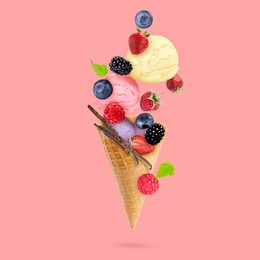 Image of Yummy ice cream scoops, wafer cone and berries in air on pink background