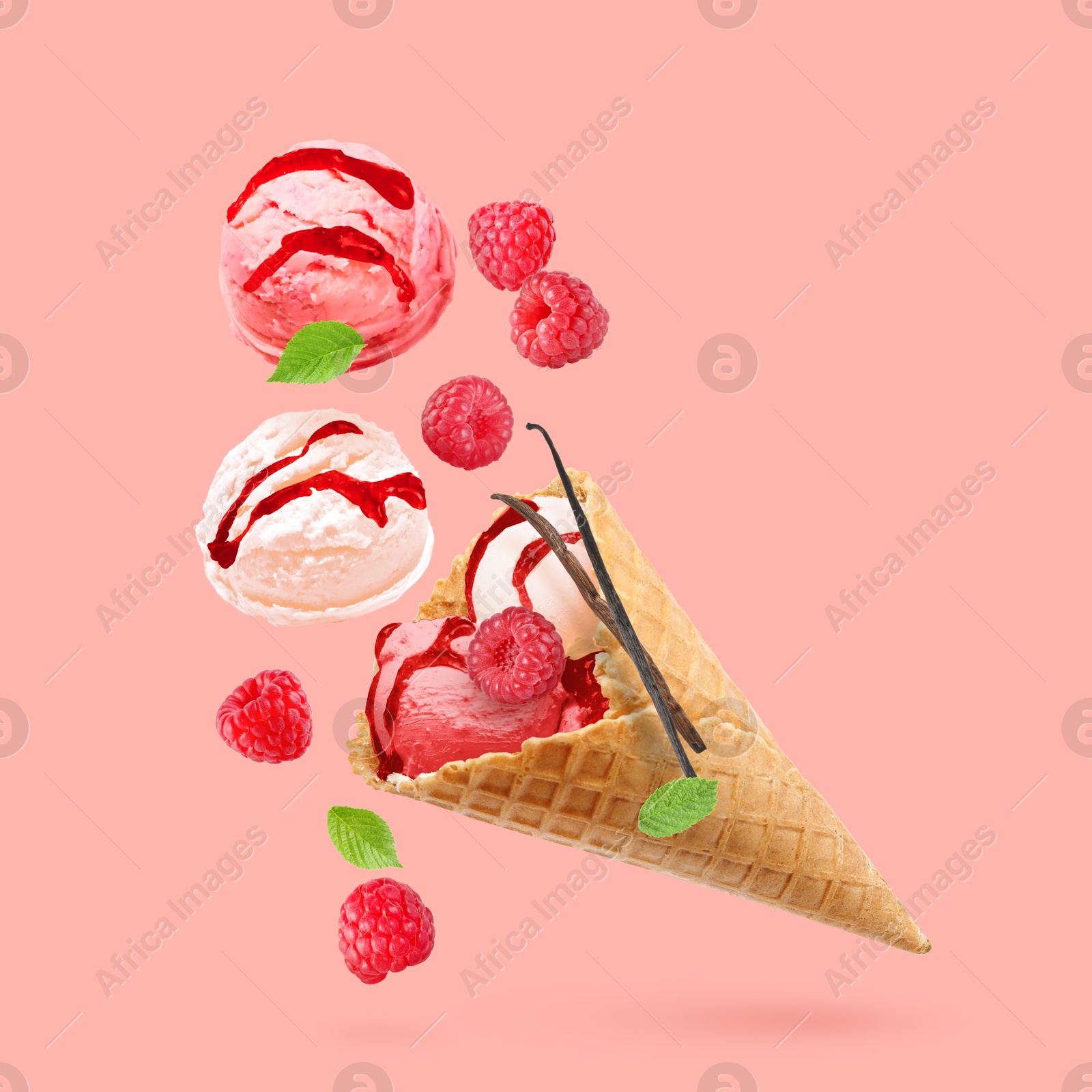 Yummy ice cream cone and raspberries in air on pink background Image of Yummy ice cream cone and raspberries in air on pink background