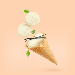 Image of Yummy vanilla ice cream cone and pods in air on beige background