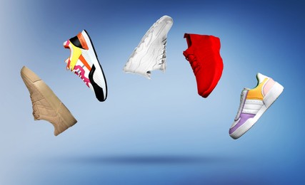 Image of Different fashionable sneakers in air on blue gradient background