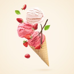Image of Yummy ice cream cone and strawberries in air on beige background