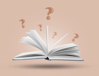 Image of Question marks above open book in air against dusty pink background