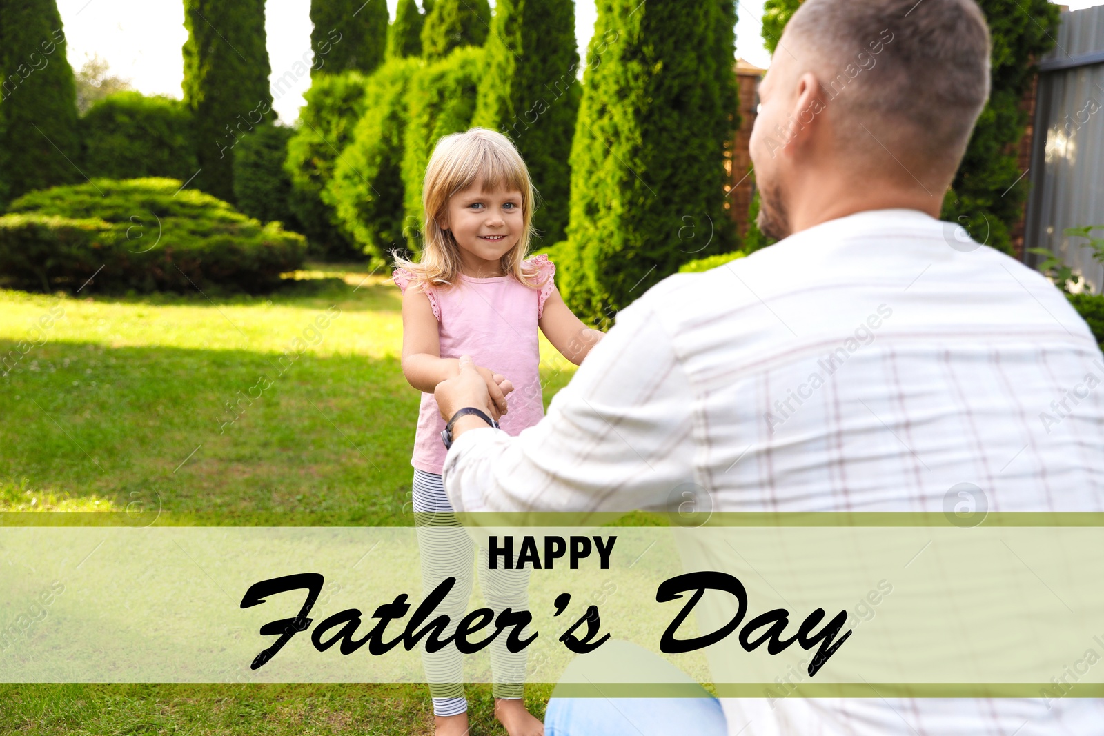Happy Father's Day. Daddy and his daughter spending time together on green lawn in park Image of Happy Father's Day. Daddy and his daughter spending time together on green lawn in park