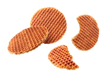 Image of Yummy Dutch waffles (stroopwafels) flying on white background