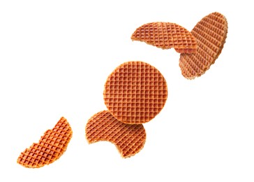 Image of Yummy Dutch waffles (stroopwafels) flying on white background