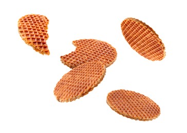 Image of Yummy Dutch waffles (stroopwafels) flying on white background