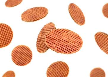 Image of Yummy Dutch waffles (stroopwafels) flying on white background