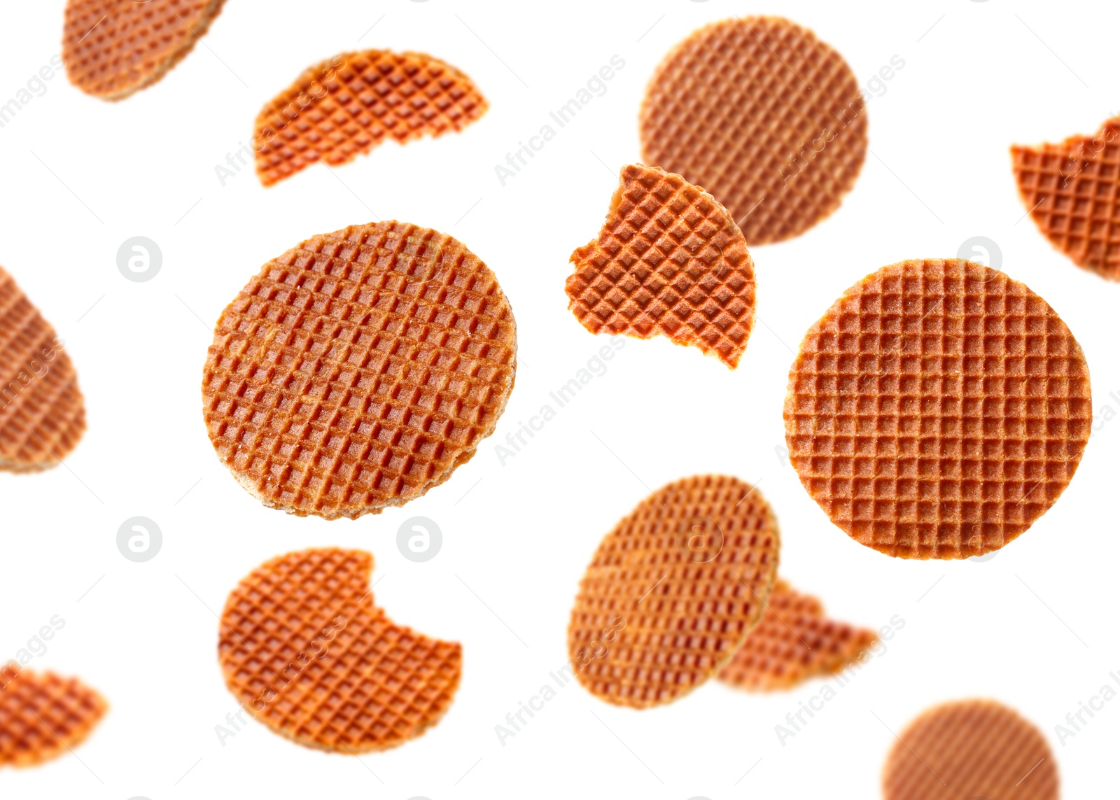 Yummy Dutch waffles (stroopwafels) flying on white background Image of Yummy Dutch waffles (stroopwafels) flying on white background
