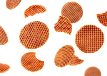 Image of Yummy Dutch waffles (stroopwafels) flying on white background