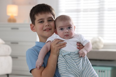 Photo of Family portrait of cute little brothers at home