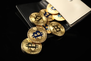 Photo of Cryptocurrency. Bitcoins in wallet on black mirror surface, closeup