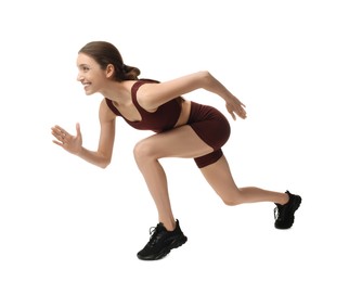 Photo of Woman in sportswear running on white background