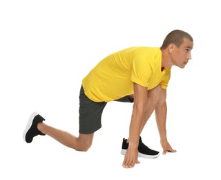 Photo of Runner in starting position on white background