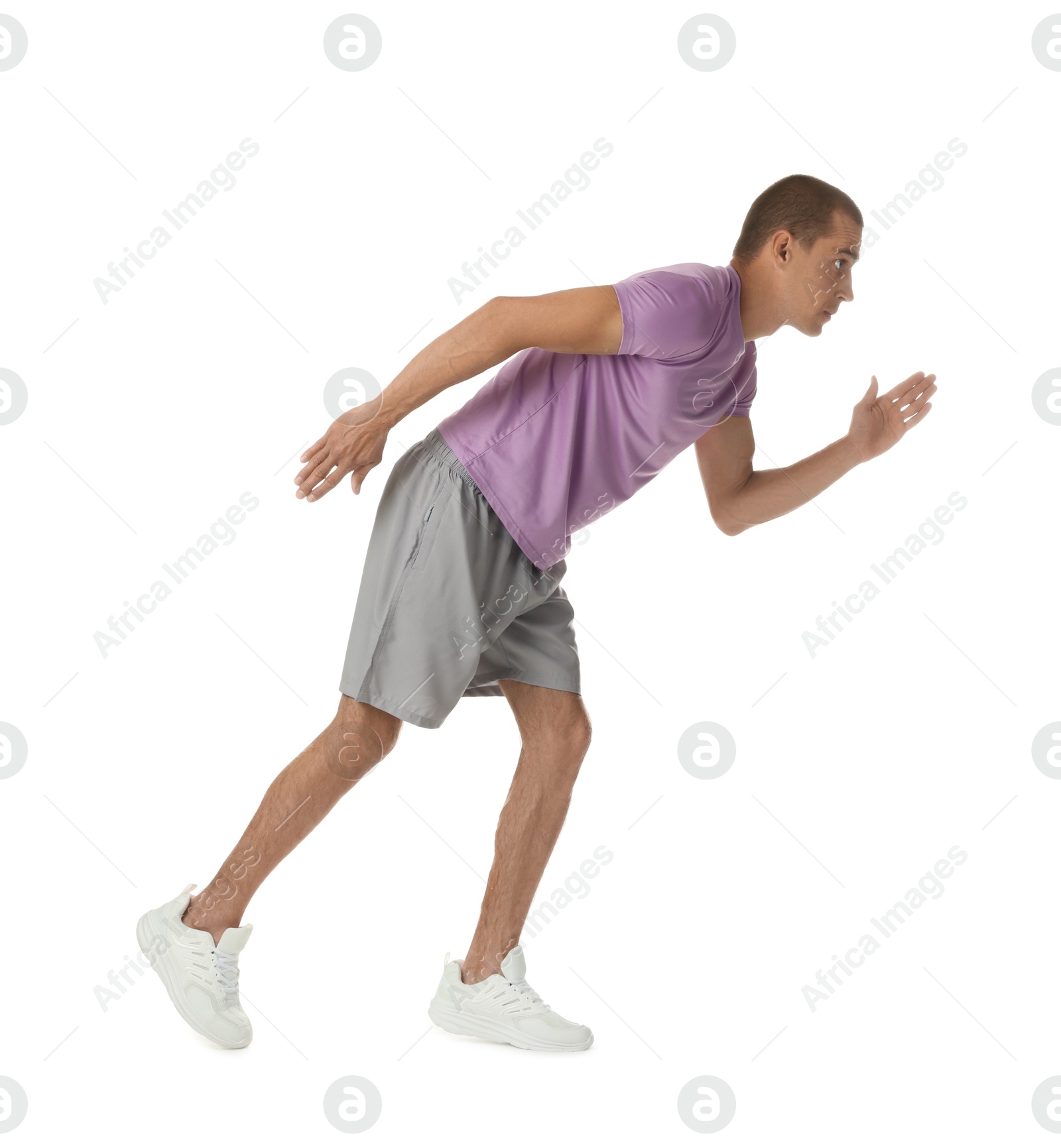 Man in sportswear running on white background Photo of Man in sportswear running on white background