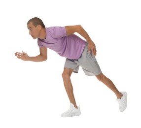 Photo of Man in sportswear running on white background