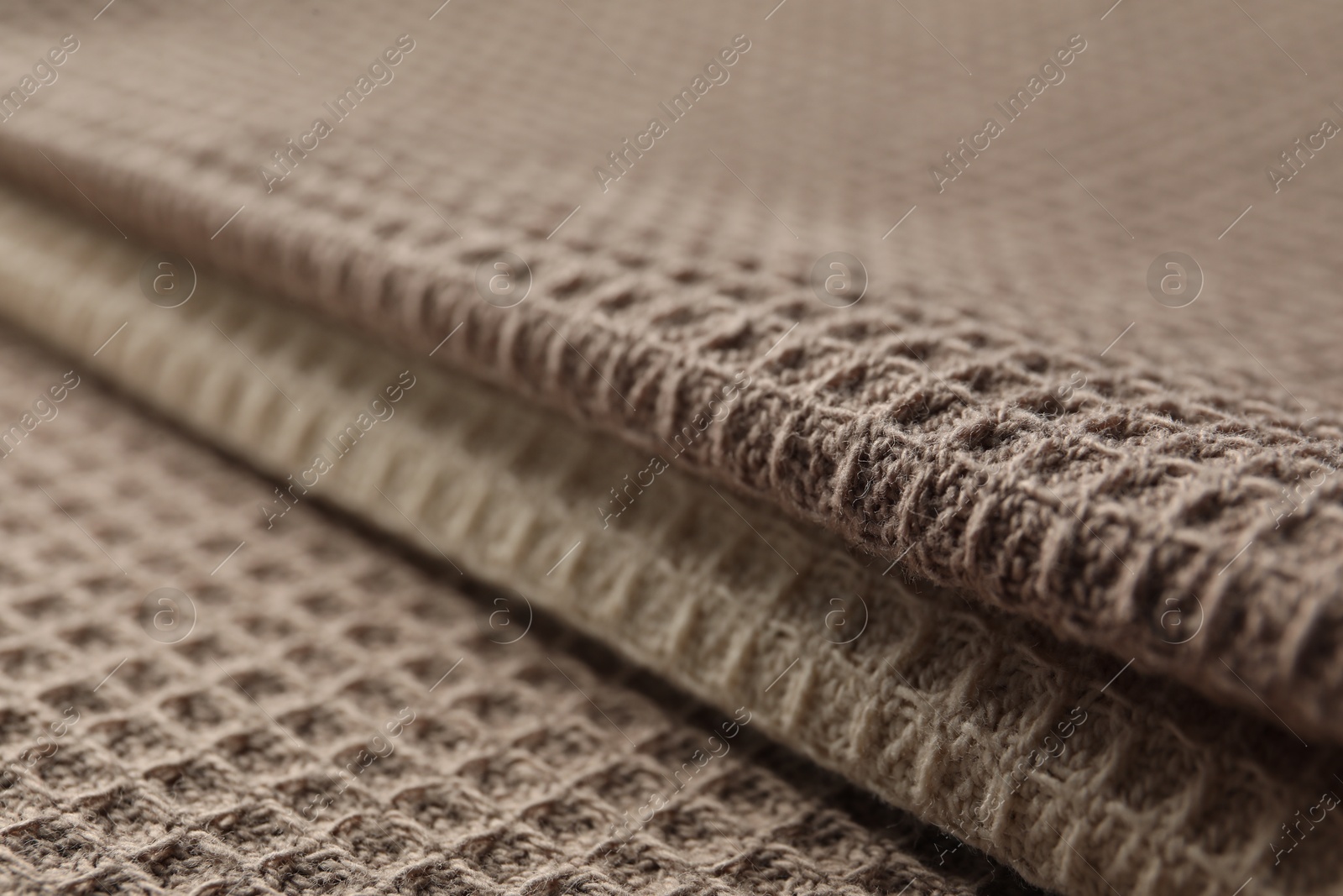Different colorful waffle towels as background, closeup Photo of Different colorful waffle towels as background, closeup