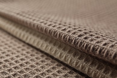 Photo of Different colorful waffle towels as background, closeup
